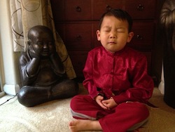 The author’s younger son striving to achieve the same “inner peace” as his hero, <em>Kung Fu Panda</em>.