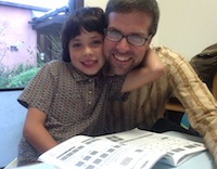 The author and his son doing homework in the offices of the Greater Good Science Center at UC Berkeley.