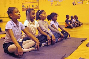 Kids learning mindfulness from the Holistic Life Foundation in Baltimore, Maryland.