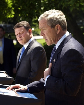 Jordan’s King Abdullah II and President Bush in the White House Rose Garden discussing the abuses at Abu Ghraib prison with the media on May 6, 2004.