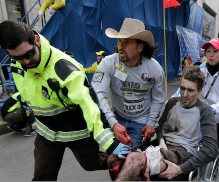 Carlos Arredondo helps a victim of the Boston Marathon bombing in April 2013. After Tsarnaev was sentenced to death, Arredondo <a href=“https://www.youtube.com/watch?v=235xD5dfNoY”>expressed profound ambivalence</a> about the verdict.