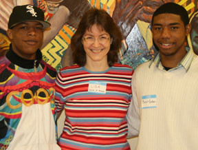 Lisa Calderone-Stewart (center) with two graduates of her program, Ryan (left) and Marquis.