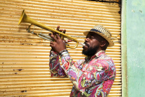 Cuban musician playing trumpet in the street