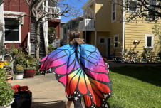 The daughter of author Courtney E. Martin wanders through their cohousing community in a butterfly costume.