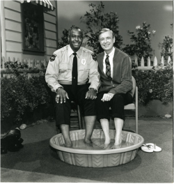 <a href=“https://commons.wikimedia.org/wiki/File:DivaMan_as_Officer_Clemmons.png#/media/File:DivaMan_as_Officer_Clemmons.png”>François Clemmons on <em>Mister Rogers’ Neighborhood</em></a>