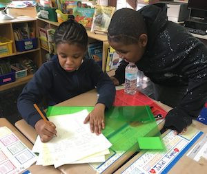 Fourth-graders at P.S. 67 often work in groups. They are asked to write several drafts of essays to get used to revising their work.