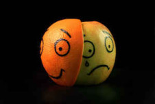 Picture of orange ball with a happy face and a sad face