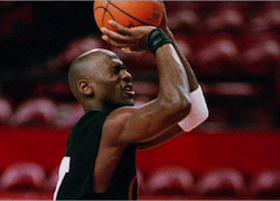 Michael Jordan shooting a free throw with his eyes closed.