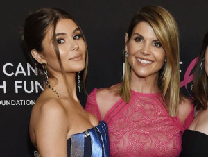 Actress Lori Loughlin, right, poses with her daughter Olivia Jade Giannulli at an event this year in Beverly Hills, Calif.