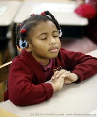 A student participating in the Mindful Schools program.