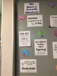 Posters emphasize fairness and a growth mindset.