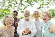 Group of older people outdoors smiling