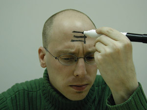 In one recent study, participants made to feel powerful were three times more likely than others to write an E on their forehead so it was forwards to themselves but backwards to others (right), suggesting they were less likely to consider other people’s points of view.