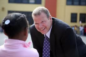 Former Oakland Unified School District Superintendent Tony Smith with student
