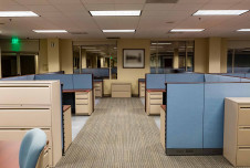 An image showing a modern office space with cubicles, designed for social distancing, reflecting changes in the workplace after COVID-19
