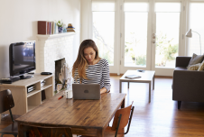 an image showing a woman working alone at home