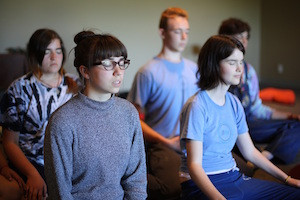 Students meditating at an iBme mindfulness retreat