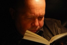 Man intently reading book
