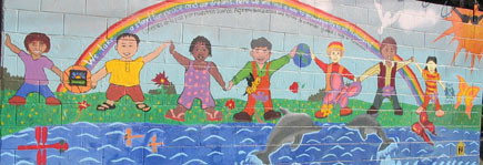 The “Peace Mural” painted across the street from Norwood Street Elementary School. It spans two walls formerly covered by grafitti.