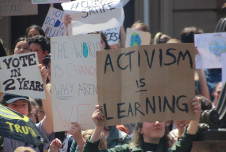 a group of young people participating in a protest