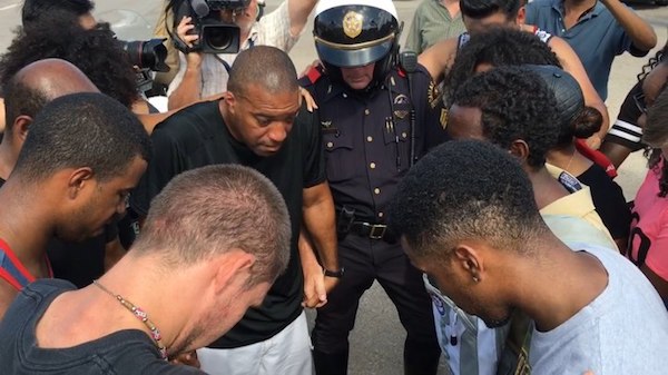 Protesters praying together in Dallas